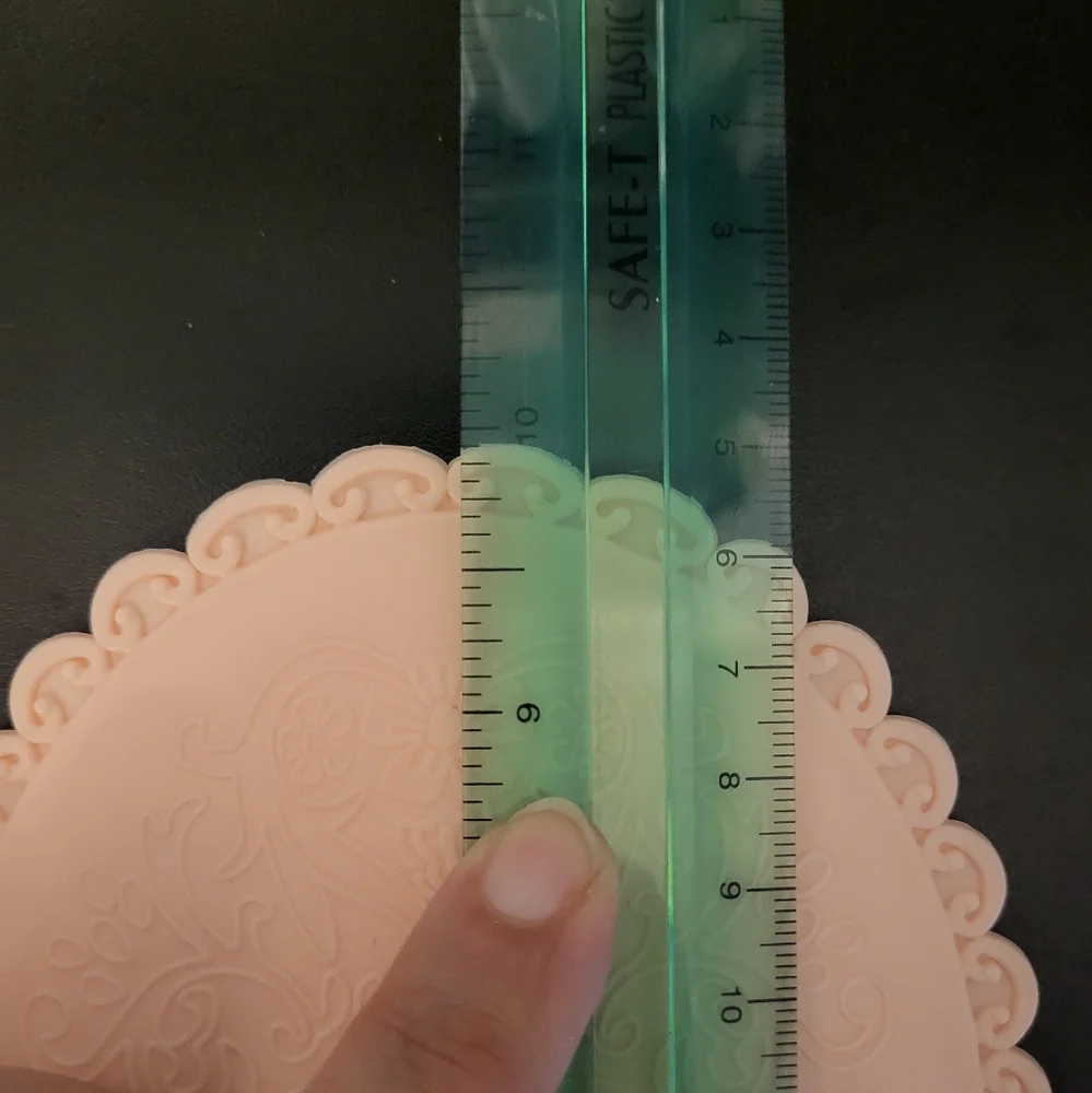 Pink plastic fantasy hand mirror
